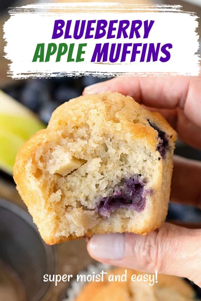 Purple and green text overlay on close up image of hand holding a bitten apple blueberry muffin.
