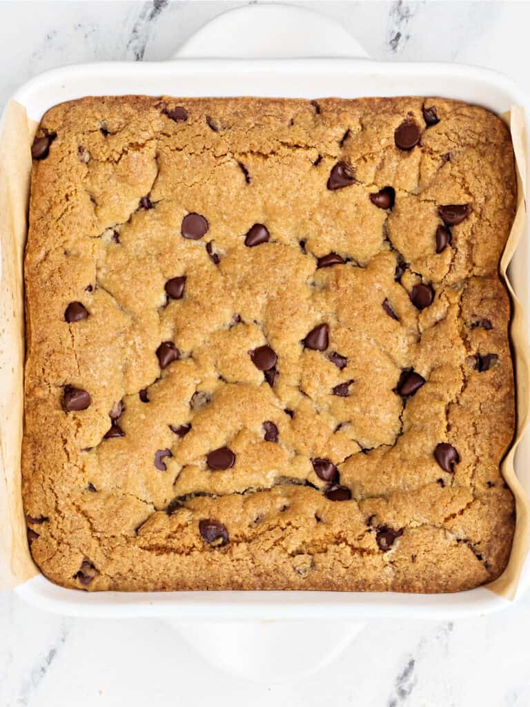 Baked brookies in a square white ceramic dish.
