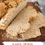 White and brown text overlay on close up image of whole wheat soda bread on a dark wood board.