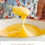 White and brown text overlay on lemon curd in a white bowl being spooned.