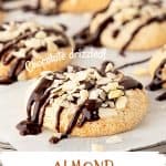 White and brown text overlay on close up image of chocolate-drizzled, almond topped macaroon cookies on white paper.