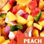 Orange and white text overlay on peach and mango salsa close up.
