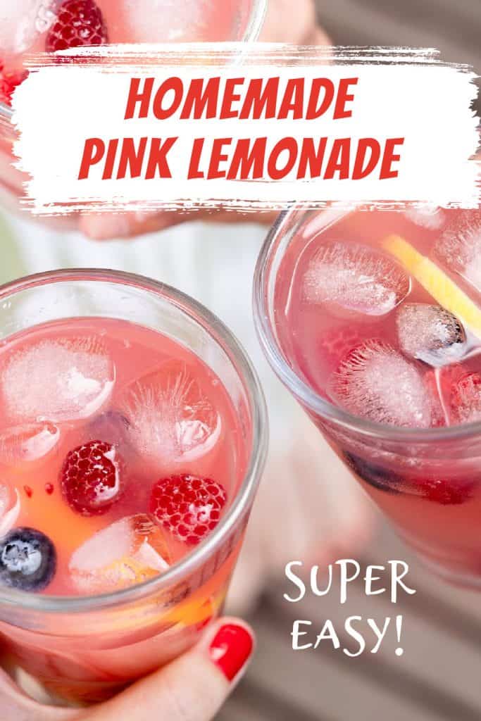 White and red text overlay on close up image of hands holding glasses of pink lemonade, ice cubes, and berries.