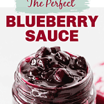 Purple and green text overlay on jar of blueberry sauce.