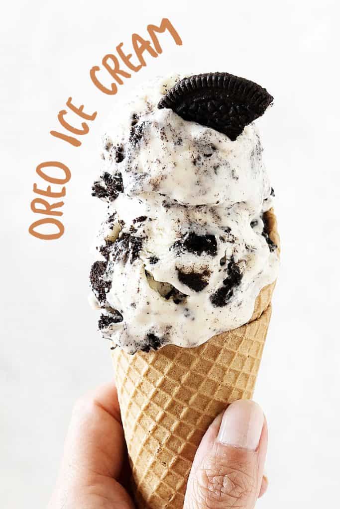 Beige text overlay on image of waffle cone with scoops of Oreo ice cream on a white background.