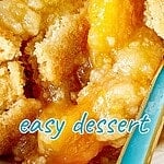 White and teal text overlay on peach dump cake close up serving.