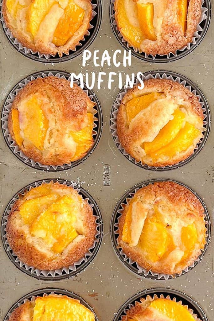 White text overlay on flat image of baked peach muffins in the metal tin.