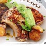 Brown and green text overlay on image of pork chops with salsa verde and potatoes on a white plate.