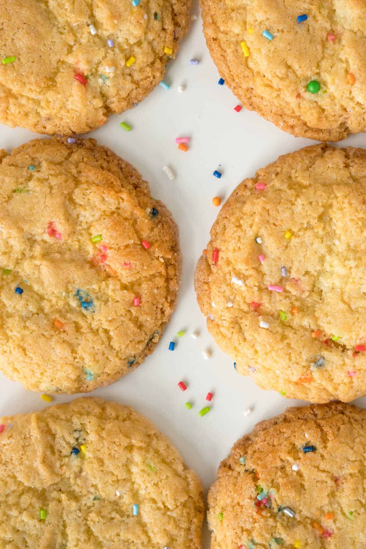 Top flat view of funfetti cookies on parchment paper. 