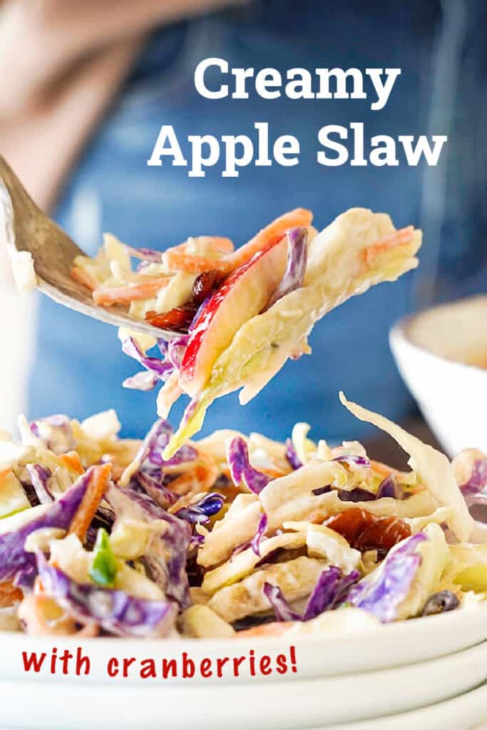 Red and white text overlay on apple slaw in a fork and stack of plates. Blue background.