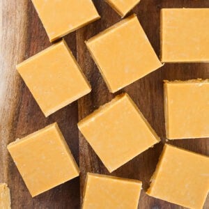 Top view of wooden board with dulce de leche squares.