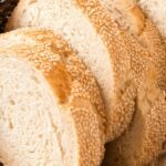 Brown and white text overlay on sliced semolina bread pieces.