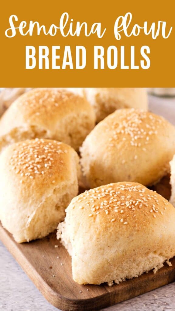 Brown and white text overlay on sesame-topped dinner rolls on a wooden board.