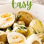 Brown, green and white text overlay on potato egg salad with dressing.