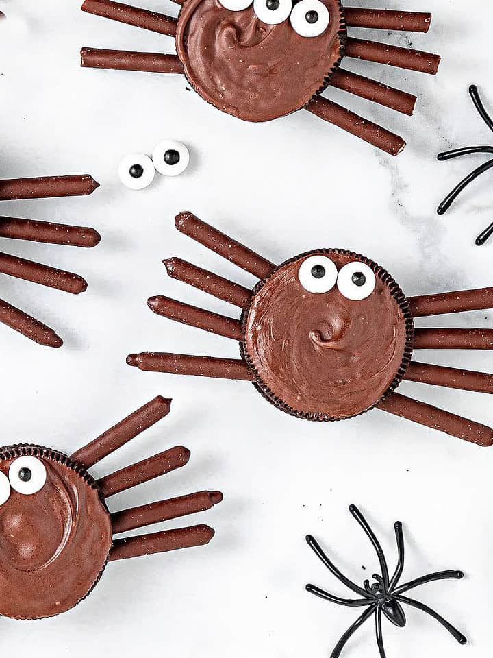 White marble with chocolate-covered Oreo spiders.