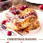 Brown and red text overlay on two images of serving and dish with cranberry baked French toast.