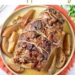 Brown, green and white text overlay on two images of sliced and whole pork stuffed with apples.