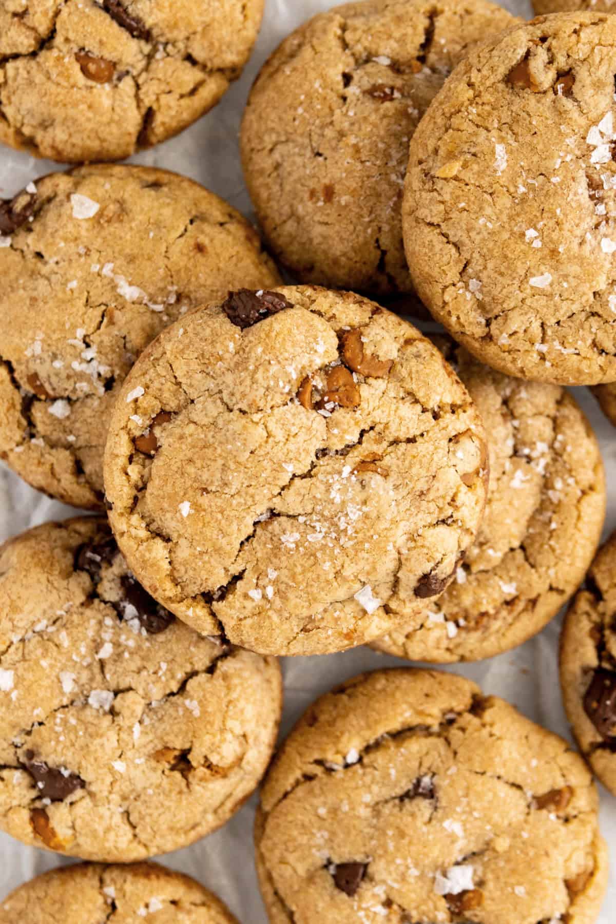 Close up of piled cookies with chips and cookie butter. 