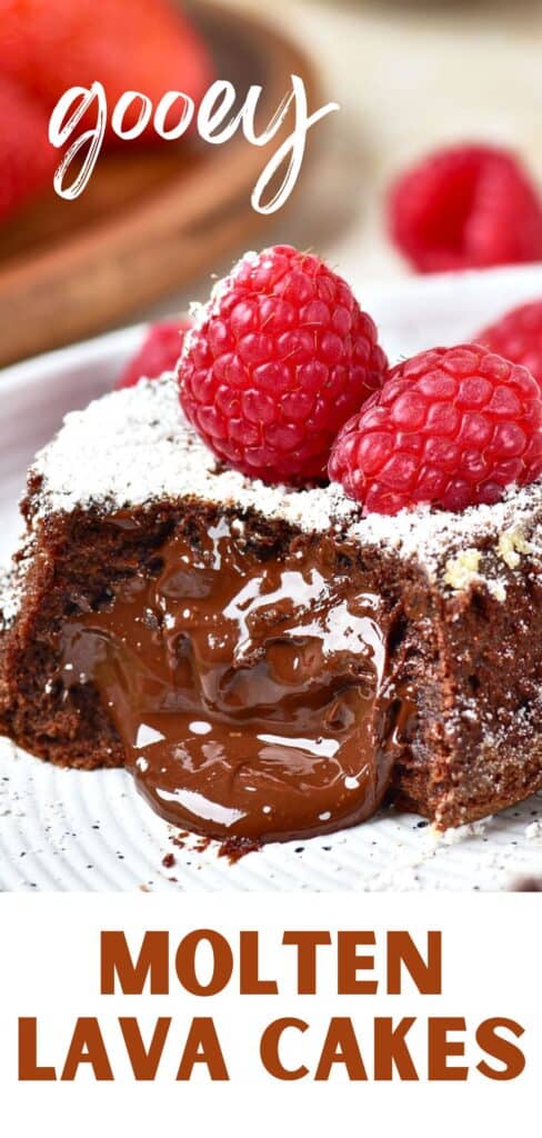Red and white text overlay on close up chocolate cake with molten center and fresh raspberries.