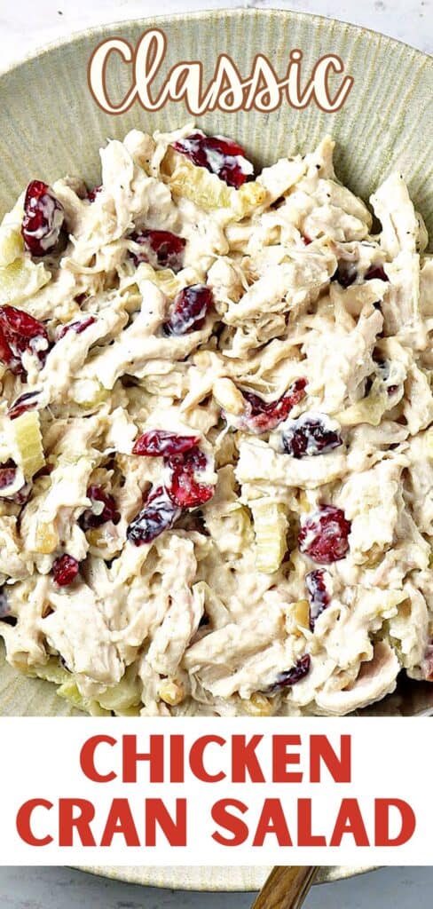 Red and white text overlay on chicken cranberry salad close up.