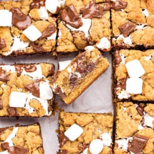 Close up s'mores bars on parchment paper.
