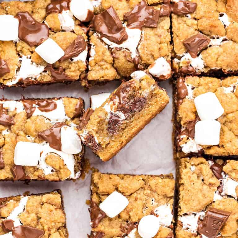 Close up s'mores bars on parchment paper.