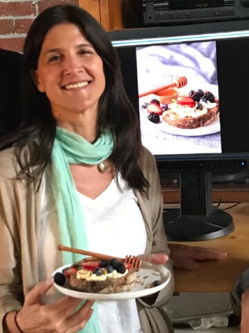 Dark haired person holding plate with food and image of said plate in background.