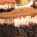 Close up half eaten tiramisu brownie. Brown and white text overlay.