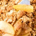 Green, white and brown text overlay on image of apple oat crisp.