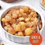 White dish with apple pie topping. Brown, green and orange text overlay.