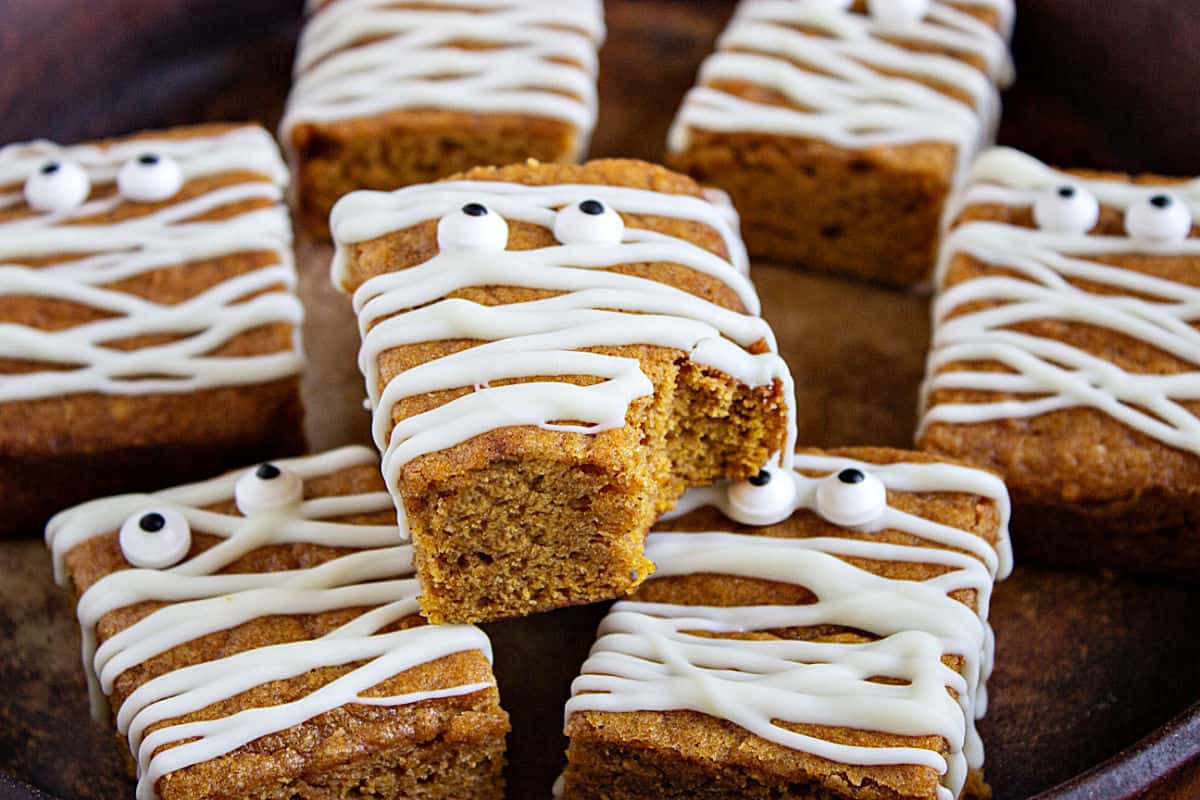 Bitten pumpkin blondie with mummy and candy eyes decoration on whole bars.