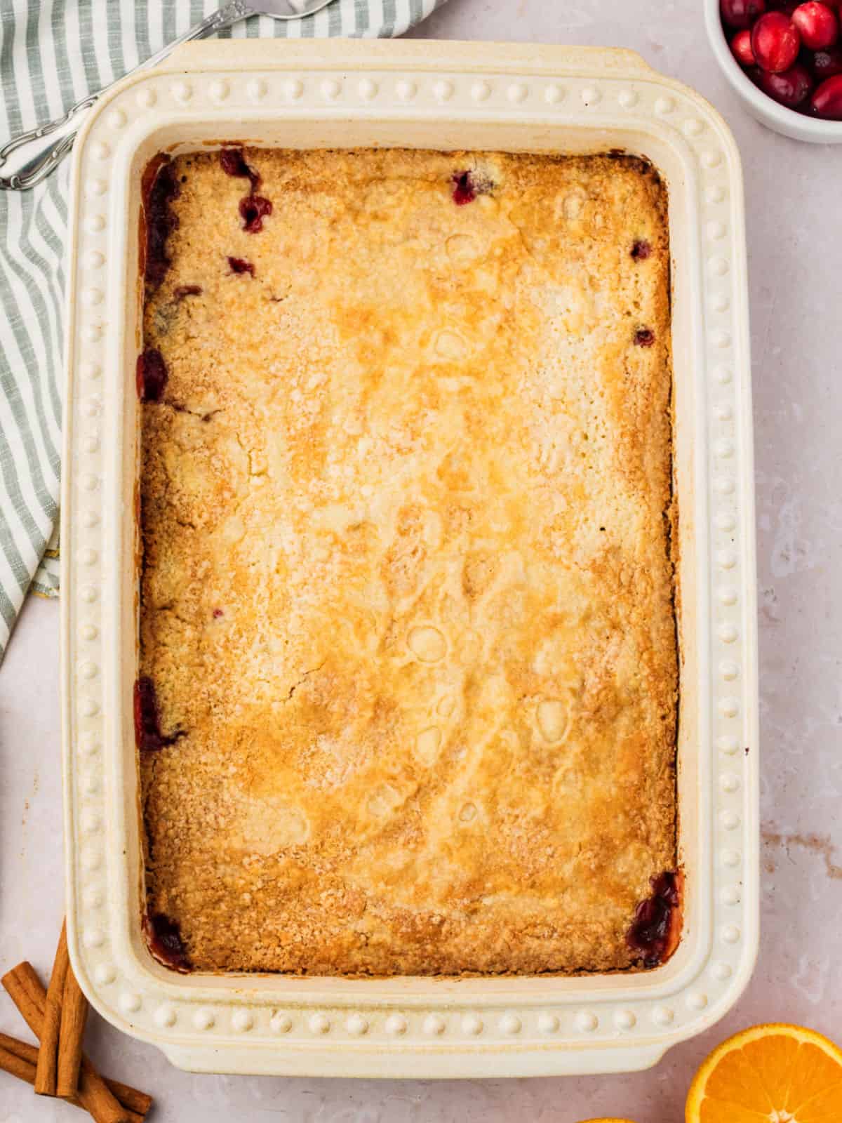 Baked dump cake in a cream-colored rectangular dish.
