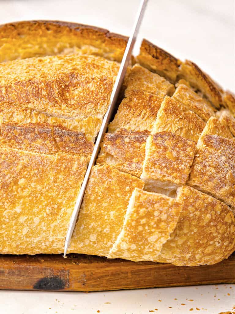 Load of bread being cut grid style.