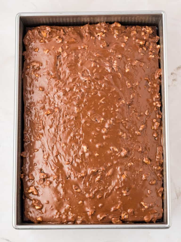 Frosted chocolate sheet cake in the metal rectangular pan.