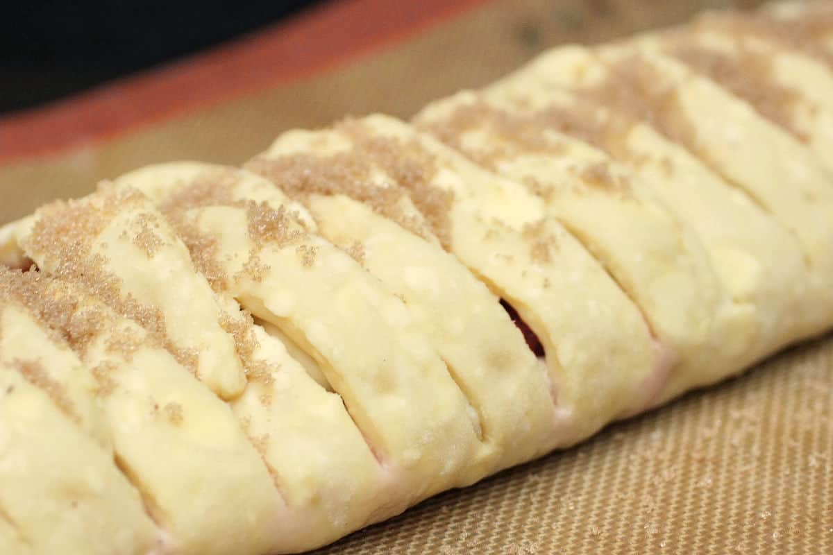 Parcial view of braided danish with sugar before baking.
