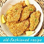 Plate and bite of cornflake-crusted chicken. Turquoise and brown text overlay.